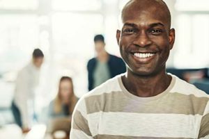 A man smiles as he thinks of general dentistry in Gulfgate, TX.