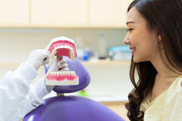 How To Prevent Tooth Decay a woman learns how to prevent tooth decay