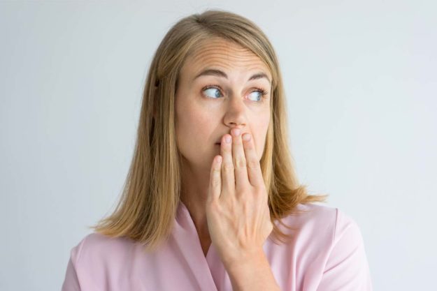 causes-of-bad-breath (4) woman wondering about the causes of bad breath
