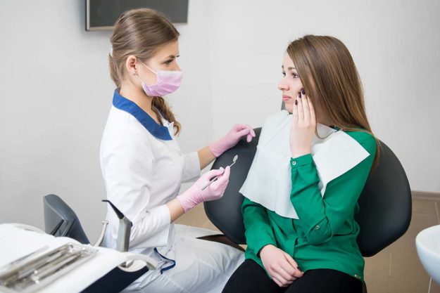What Are Emergency Dental Services a woman gets access to dental services