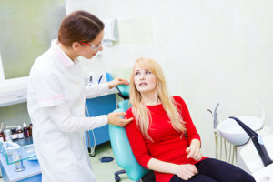 dentist and patient discussing impacted teeth