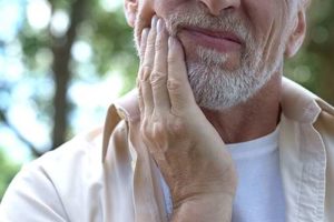 man suffering from teeth grinding