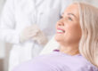 woman learning about her new dental implant
