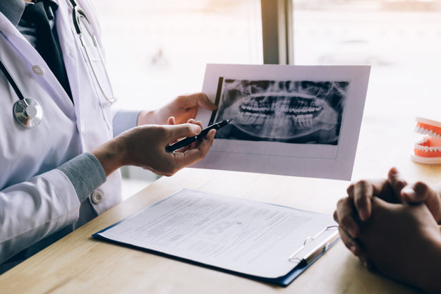 5 Signs You Need Dental Braces Again (1) patient showing signs of needing dental braces